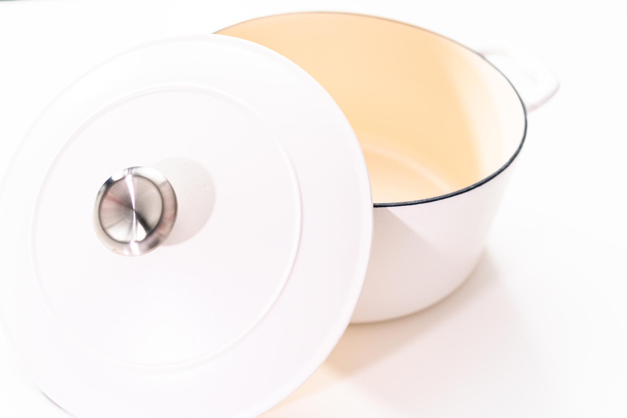 High-tech cookware arranged on white surface